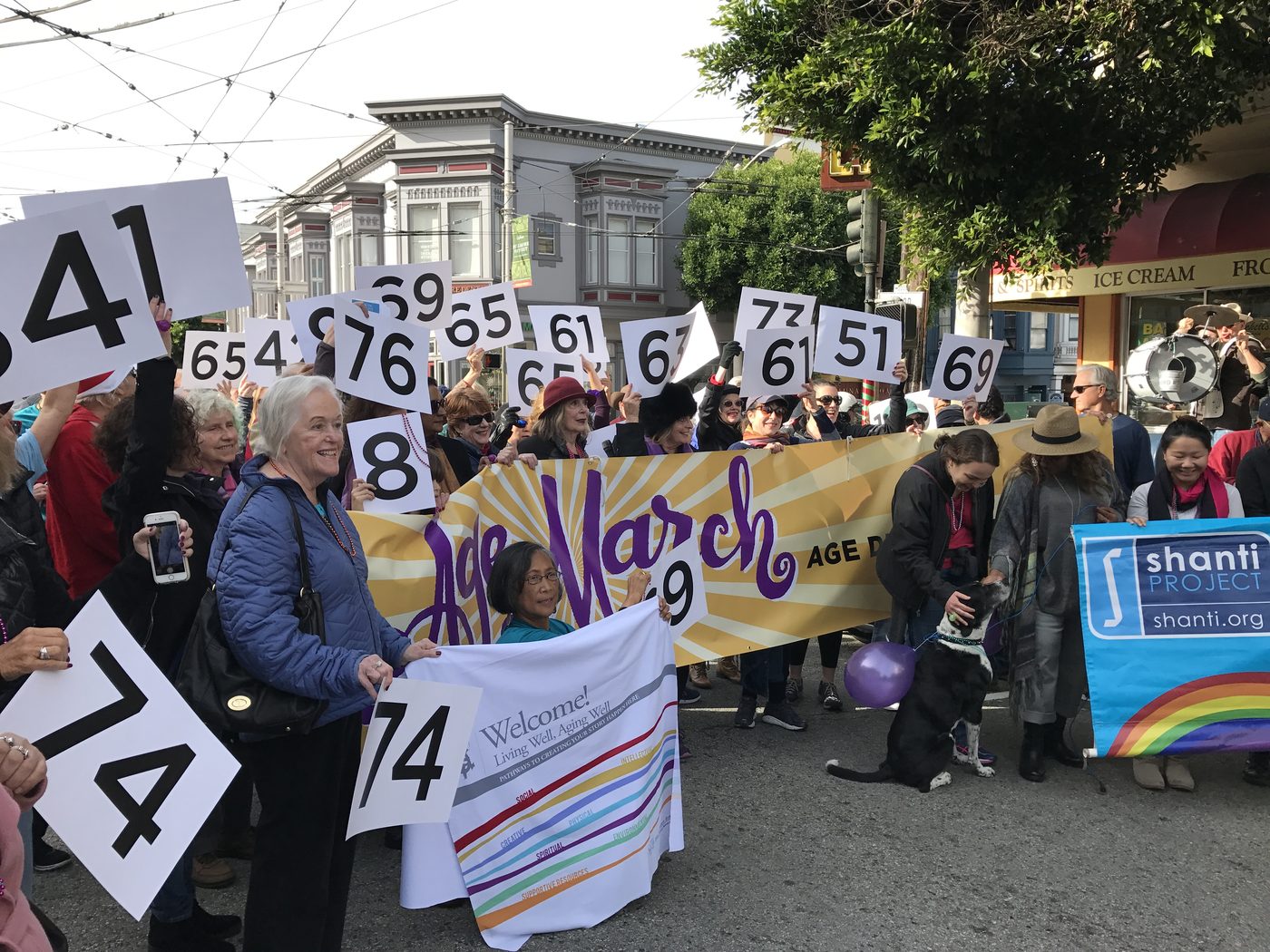Age March participants carrying age number signs